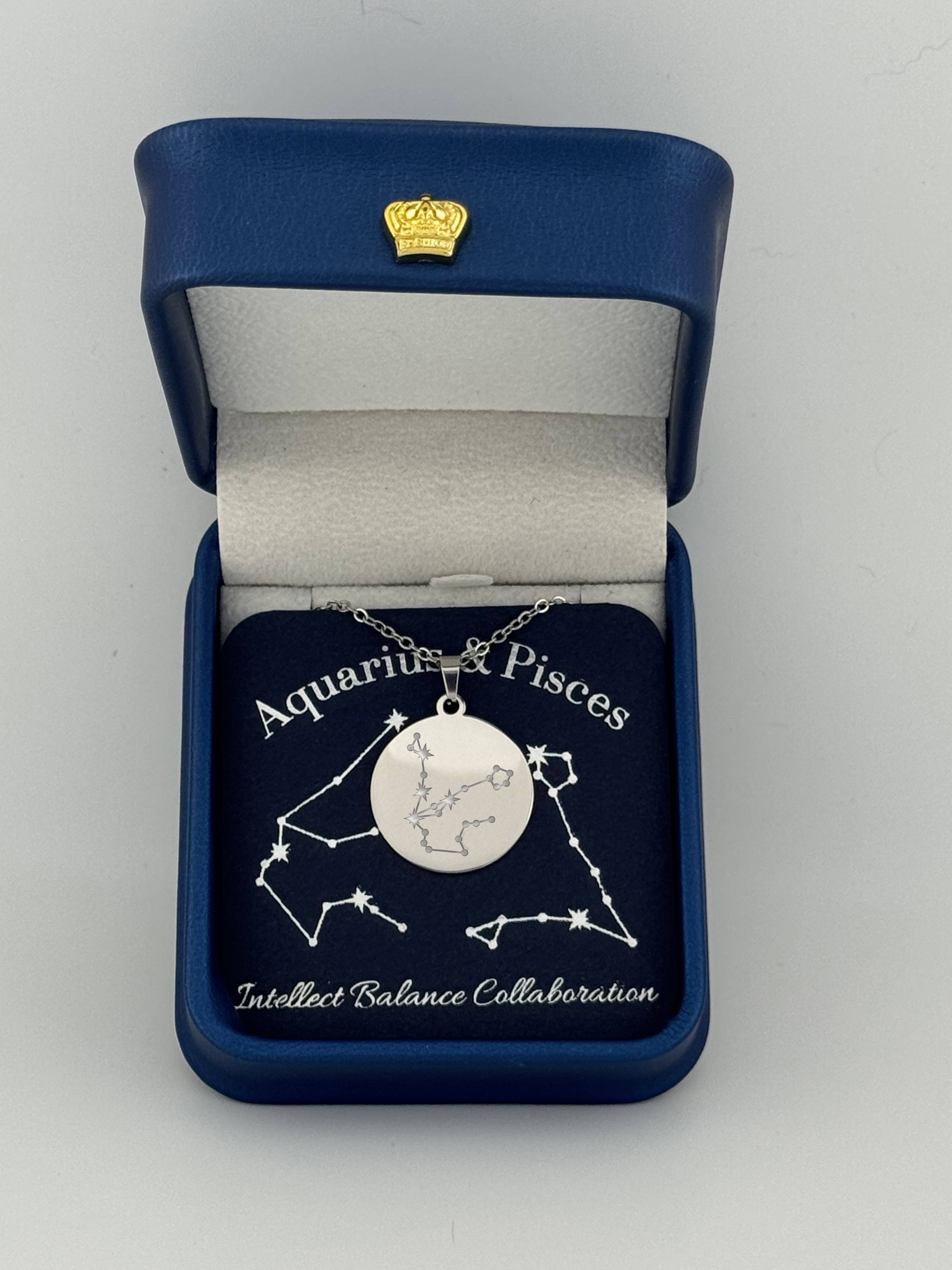 Silver Aquarius + Pisces constellation medallion necklace in gift box with silver foil zodiac card
