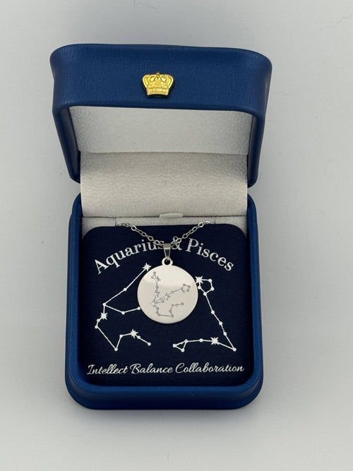 Silver Aquarius + Pisces constellation medallion necklace in gift box with silver foil zodiac card
