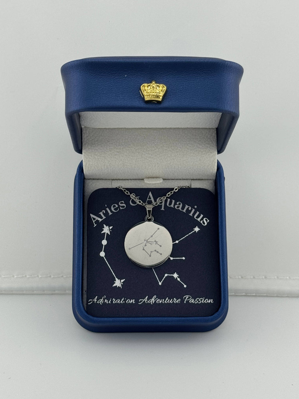 Silver Aries + Aquarius constellation medallion necklace in gift box with silver foil zodiac card
