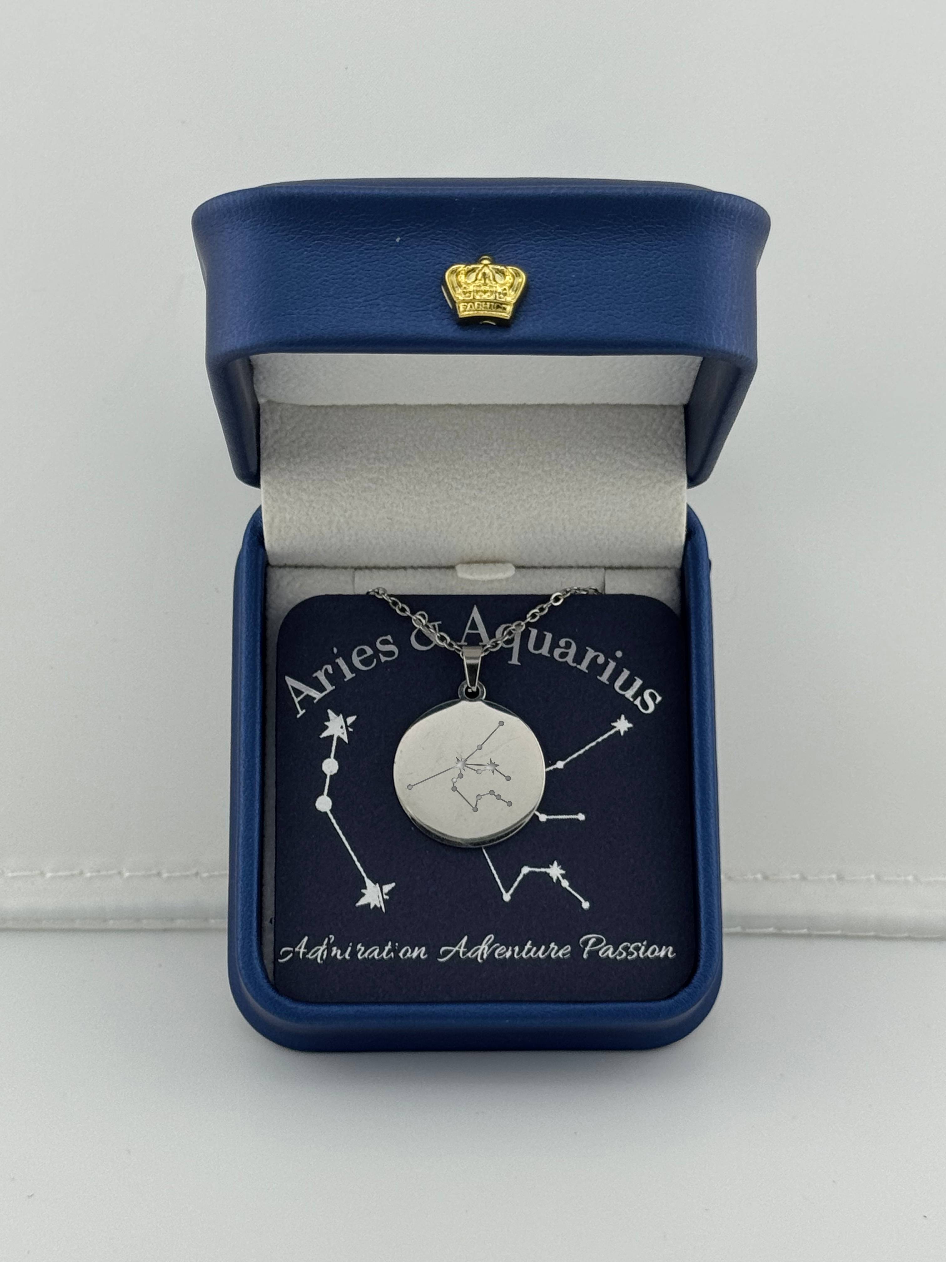 Silver Aries + Aquarius constellation medallion necklace in gift box with silver foil zodiac card
