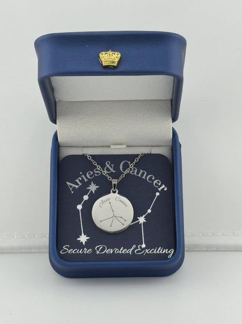 Silver Aries + Cancer constellation medallion necklace in gift box with silver foil zodiac card
