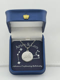 Silver Aries + Leo constellation medallion necklace in gift box with silver foil zodiac card

