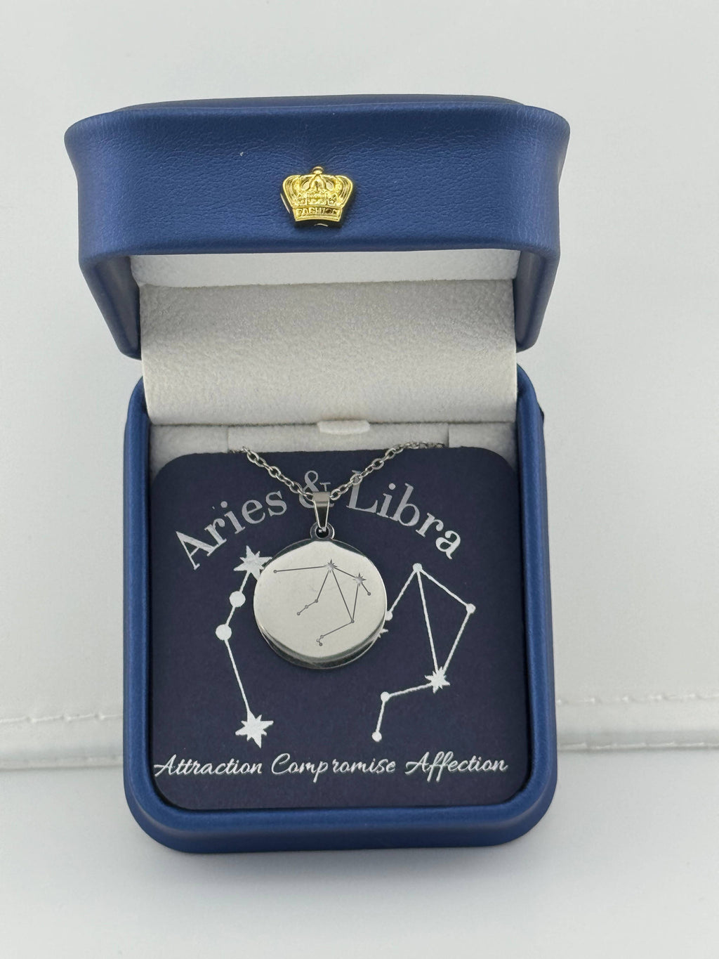 Silver Aries + Libra constellation medallion necklace in gift box with silver foil zodiac card"
