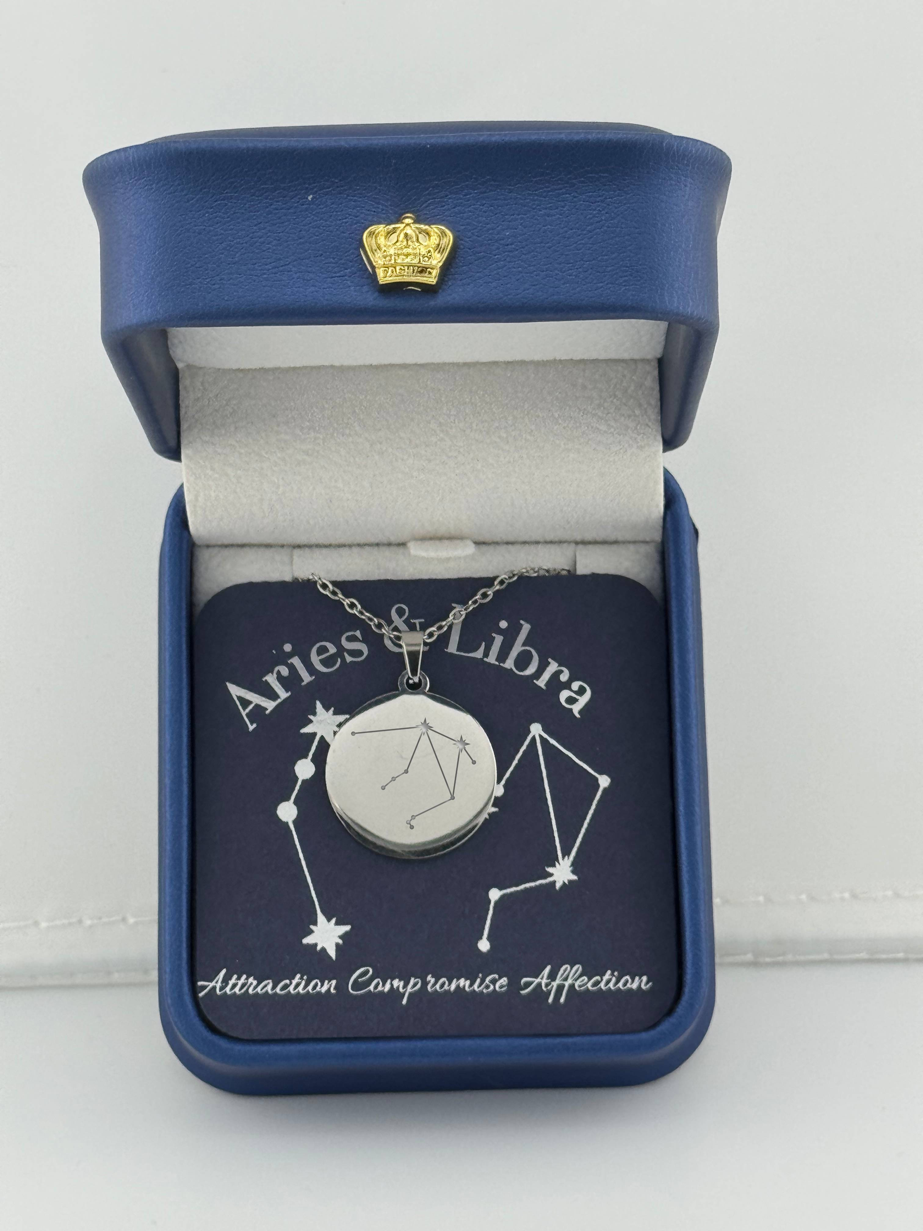 Silver Aries + Libra constellation medallion necklace in gift box with silver foil zodiac card"
