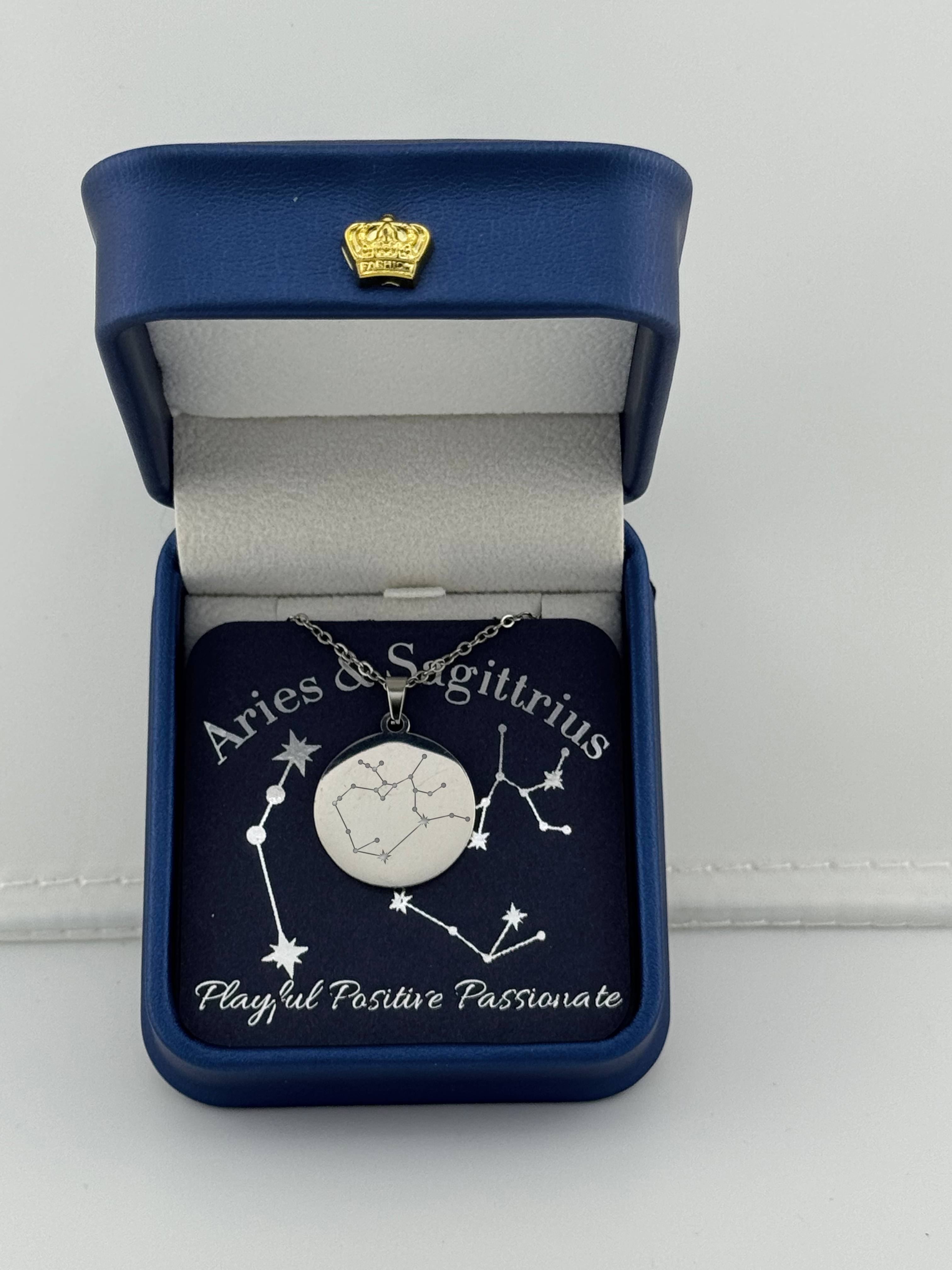 Silver Aries + Sagittarius constellation medallion necklace in gift box with silver foil zodiac card
