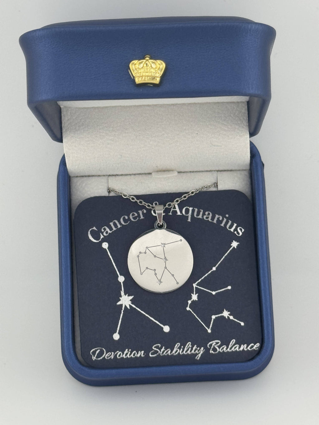 Silver Cancer and Aquarius constellation medallion necklace in gift box with silver foil zodiac card
