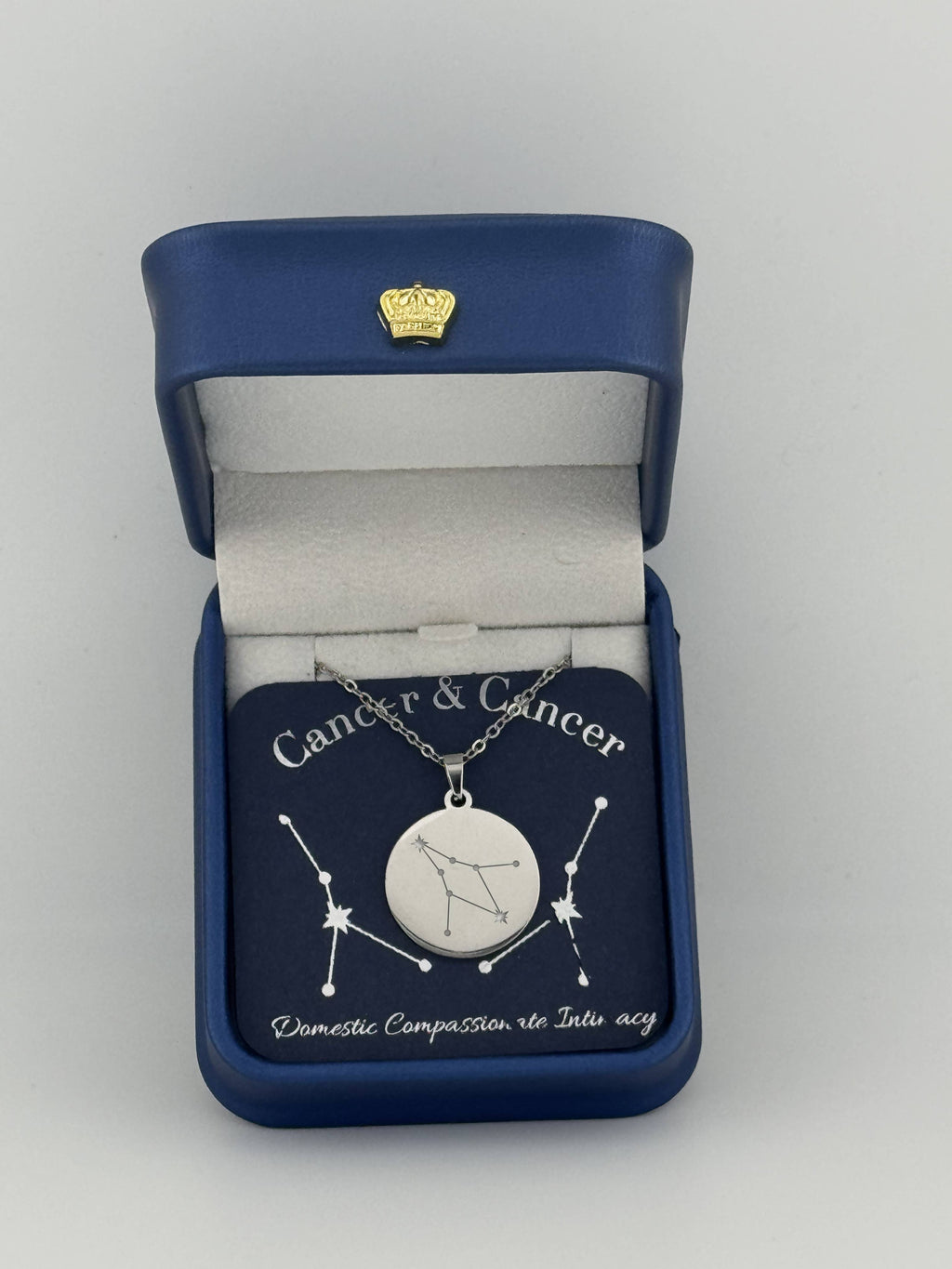 Silver Cancer + Cancer constellation medallion necklace in gift box with silver foil zodiac card
