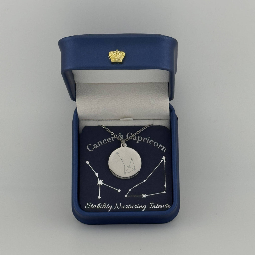 Silver Cancer and Capricorn constellation medallion necklace in gift box with silver foil zodiac card
