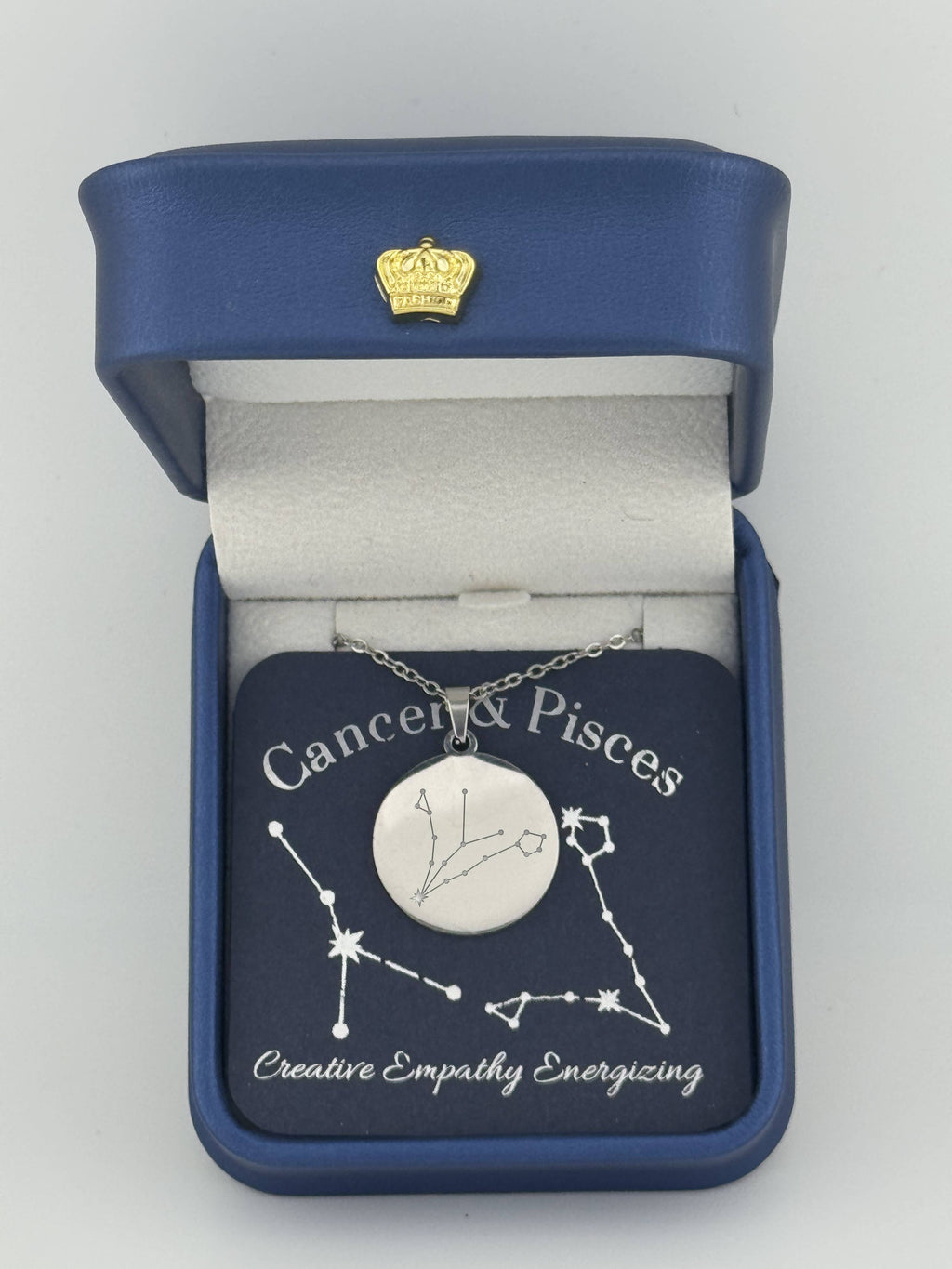 Silver Cancer and Pisces constellation medallion necklace in gift box with silver foil zodiac card
