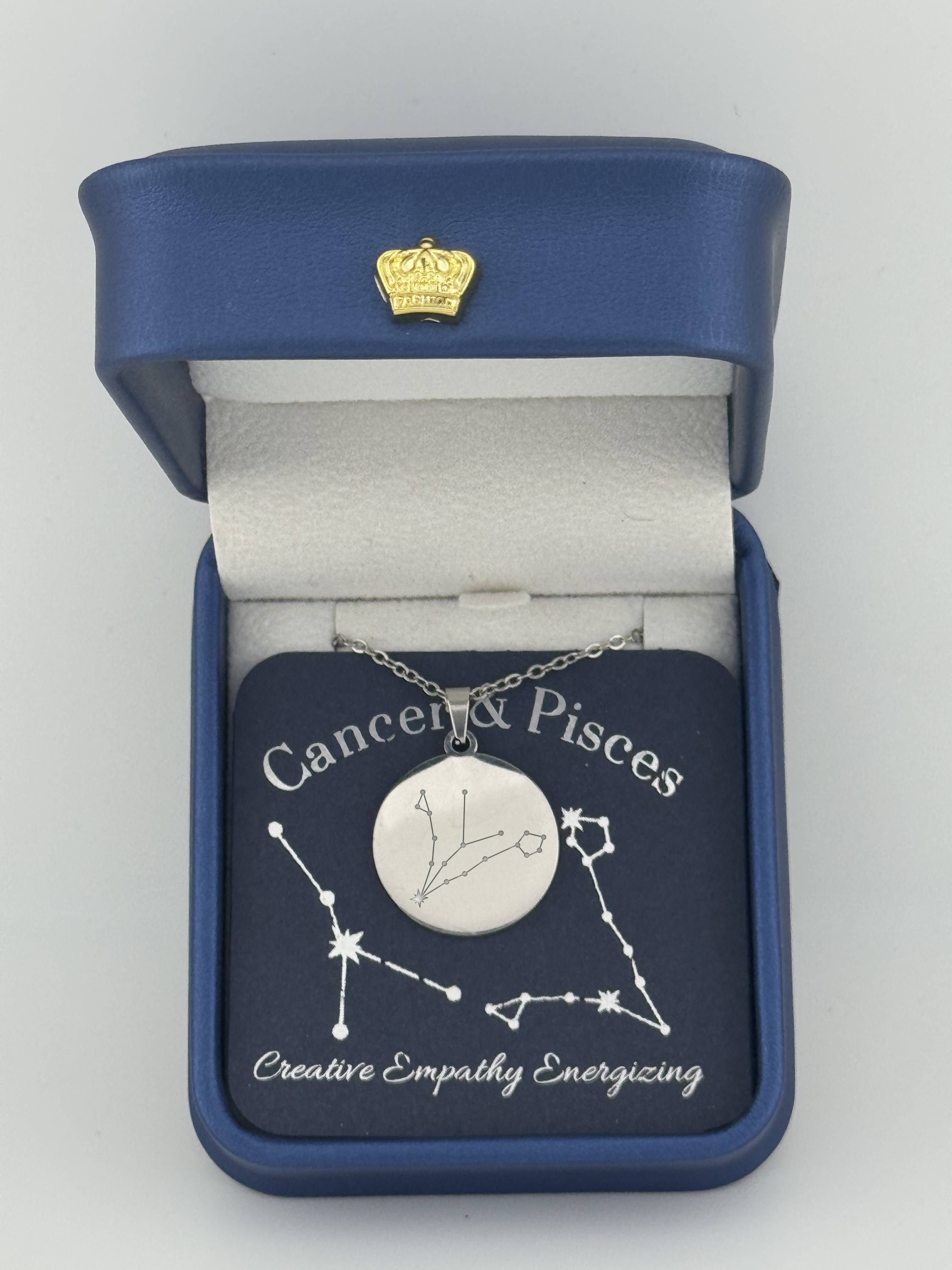 Silver Cancer and Pisces constellation medallion necklace in gift box with silver foil zodiac card
