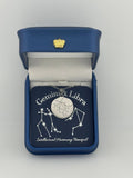 Silver Gemini + Libra constellation medallion necklace in gift box with silver foil zodiac card
