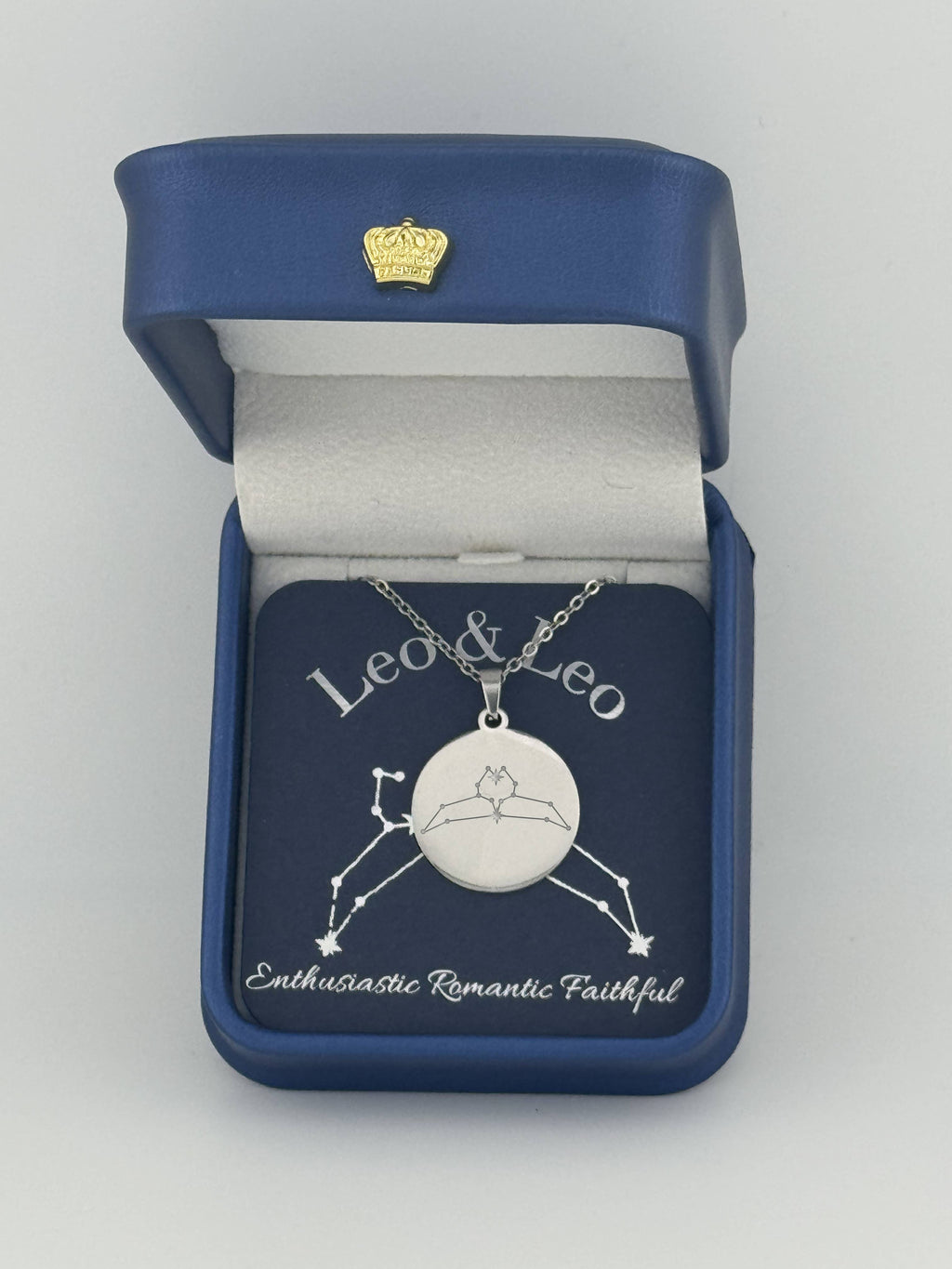 Silver Leo and Leo constellation medallion necklace in gift box with silver foil zodiac card
