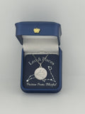 Silver Leo and Pisces constellation medallion necklace in gift box with silver foil zodiac card
