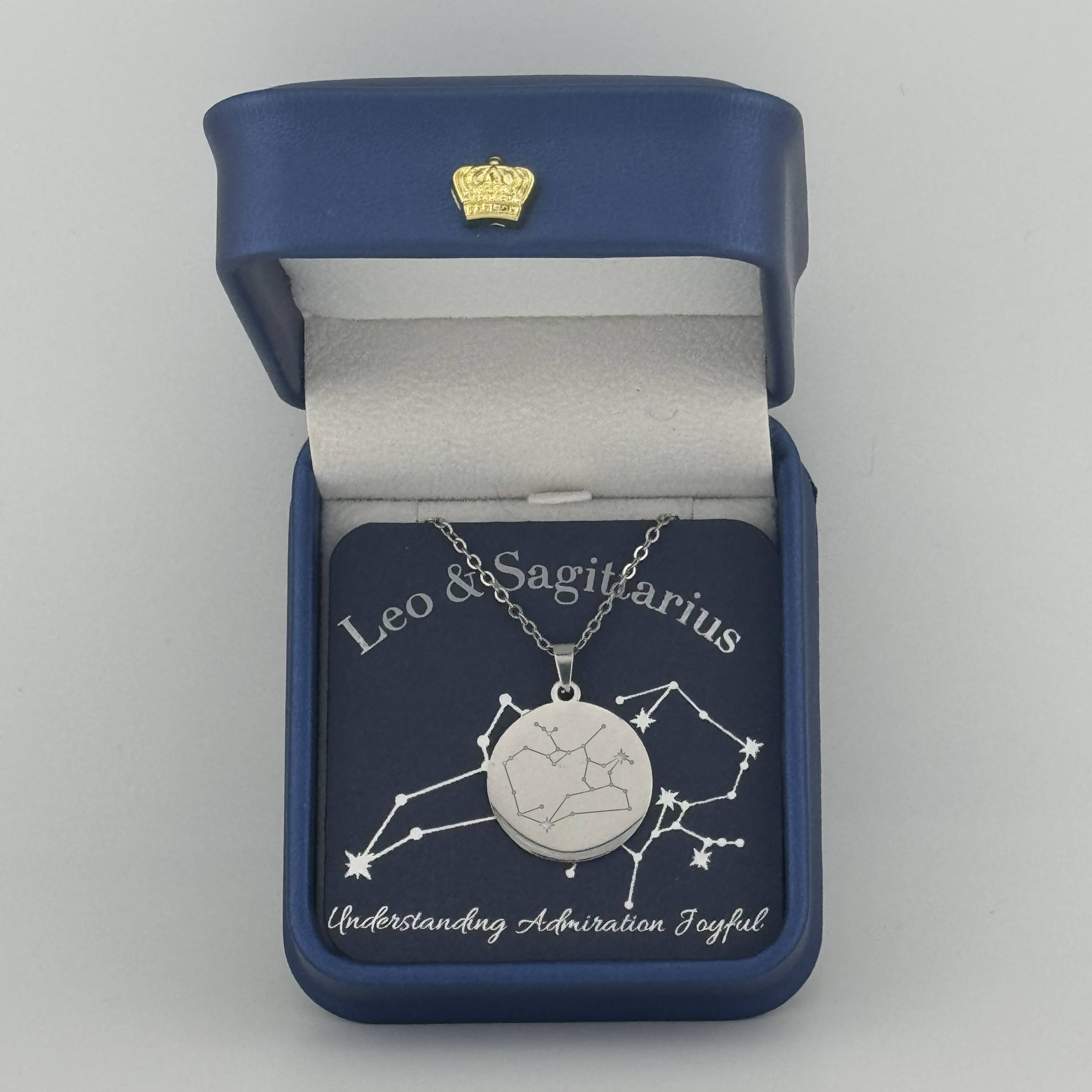 Silver Leo and Sagittarius constellation medallion necklace in gift box with silver foil zodiac card
