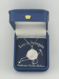 Silver Leo and Scorpio constellation medallion necklace in gift box with silver foil zodiac card
