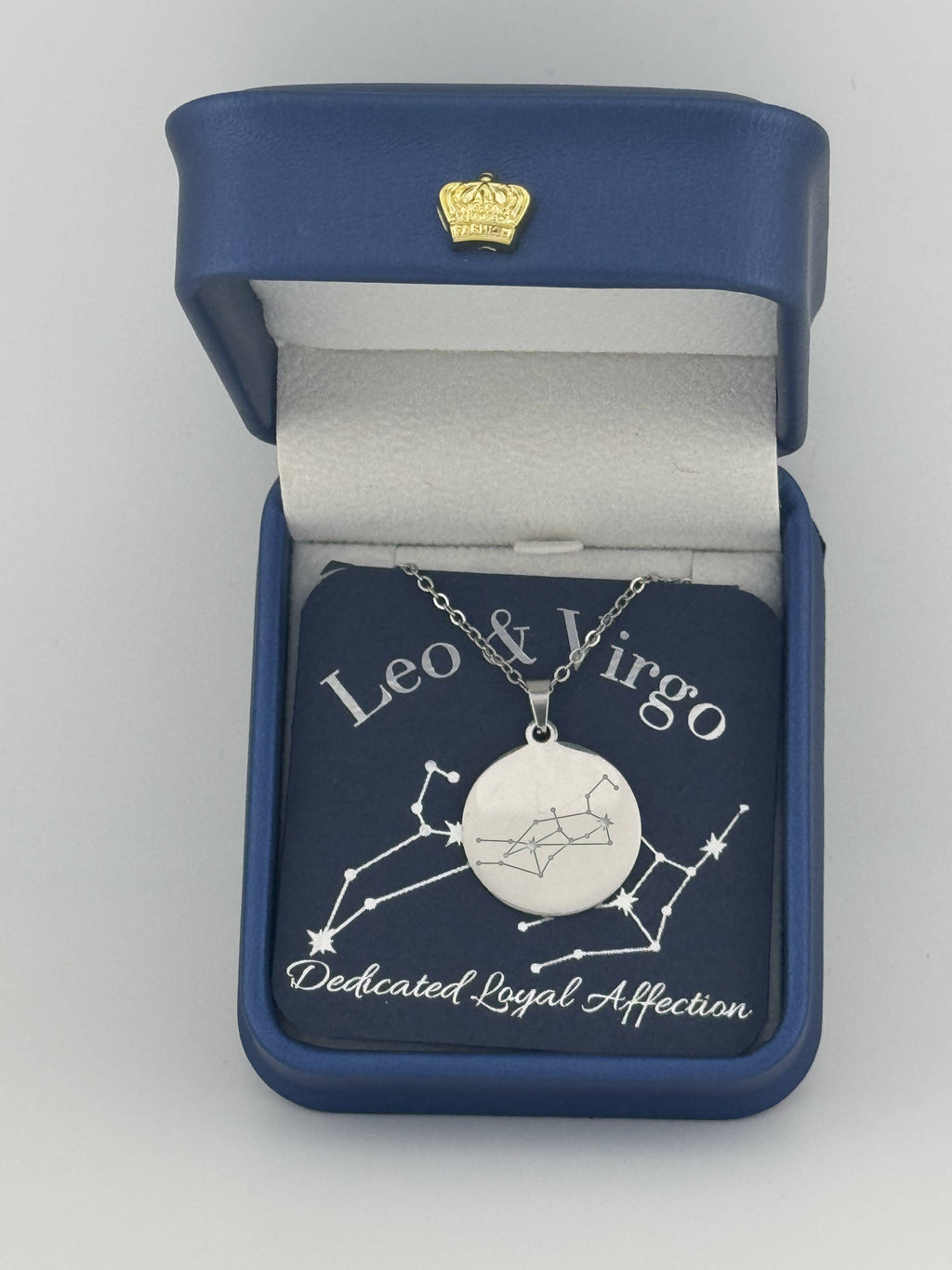 Silver Leo and Virgo constellation medallion necklace in gift box with silver foil zodiac card
