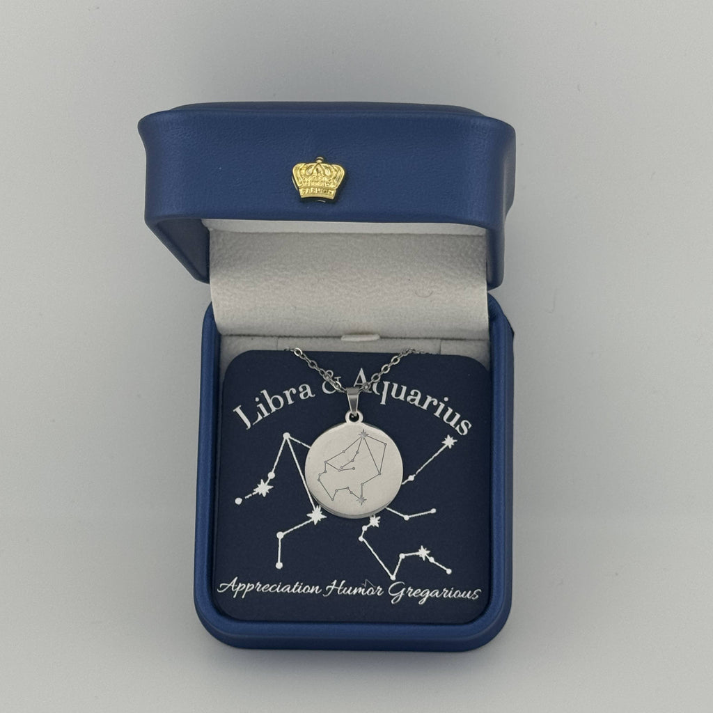 Silver Libra and Aquarius constellation medallion necklace in gift box with silver foil zodiac card
