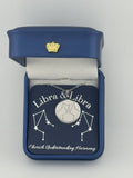 Silver Libra and Libra constellation medallion necklace in gift box with silver foil zodiac card
