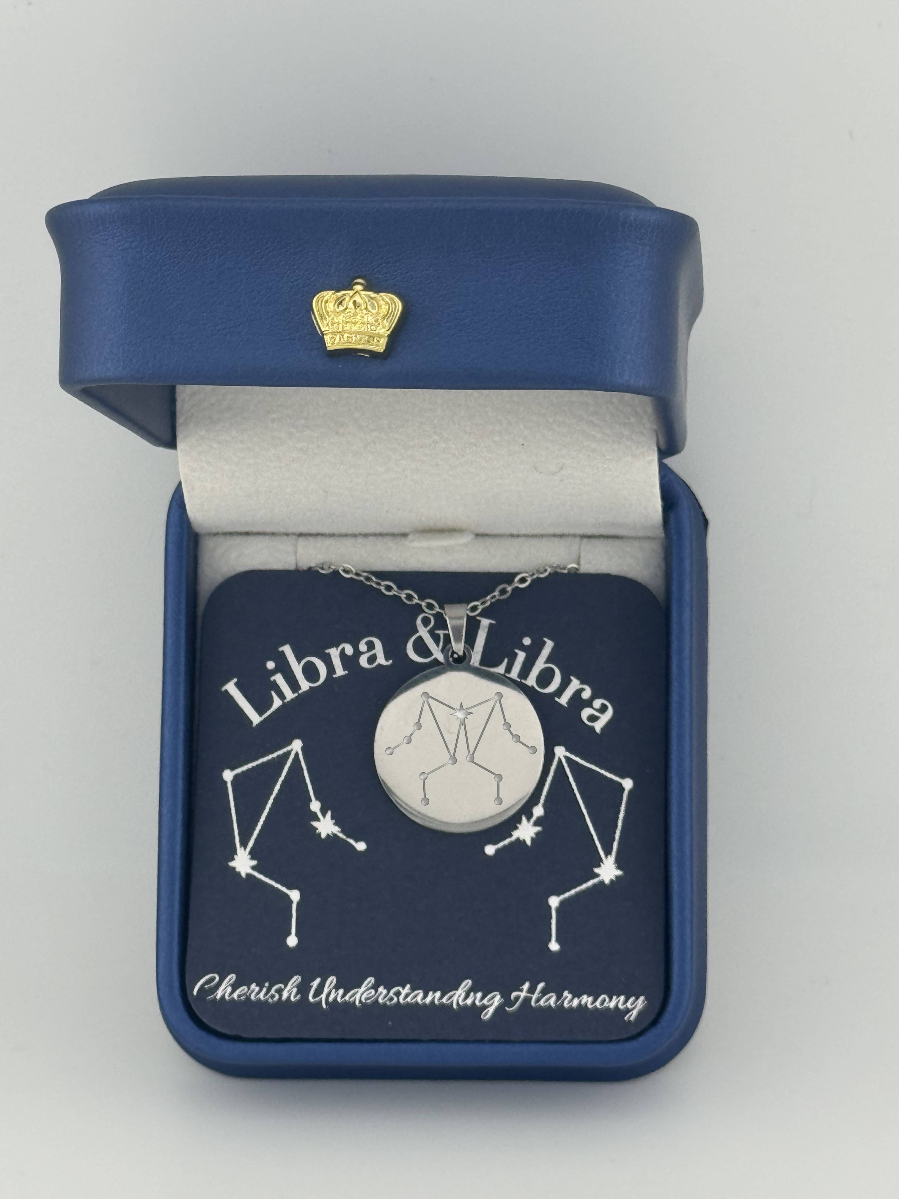 Silver Libra and Libra constellation medallion necklace in gift box with silver foil zodiac card
