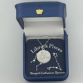 Silver Libra and Pisces constellation medallion necklace in gift box with silver foil zodiac card
