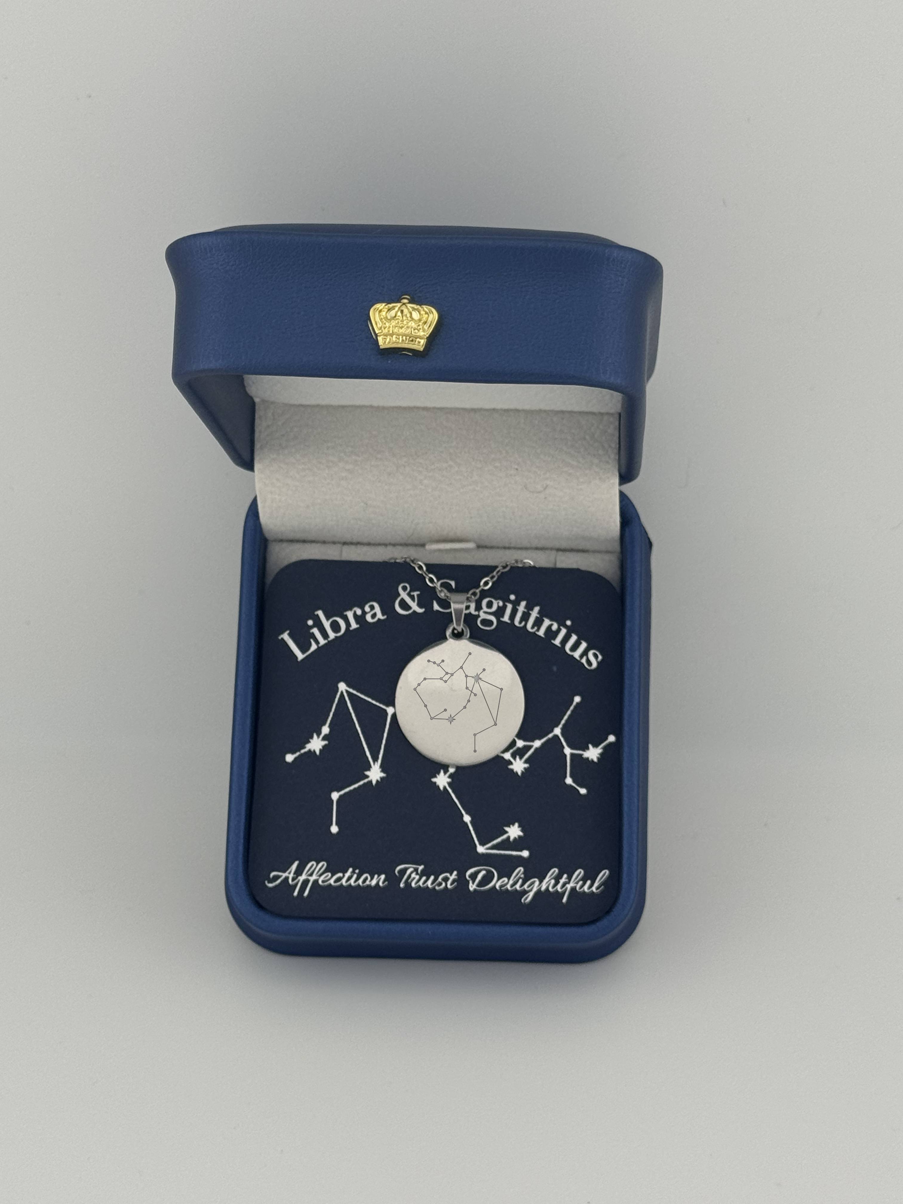 Silver Libra and Sagittarius constellation medallion necklace in gift box with silver foil zodiac card
