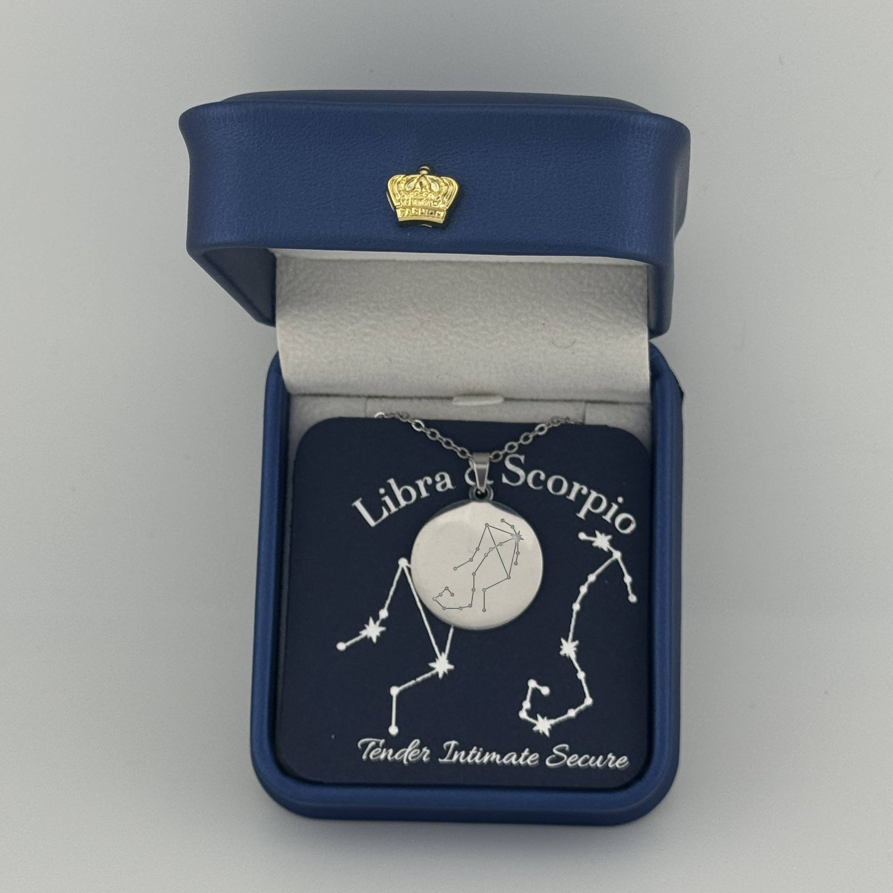 Silver Libra And Scorpio constellation medallion necklace in gift box with silver foil zodiac card
