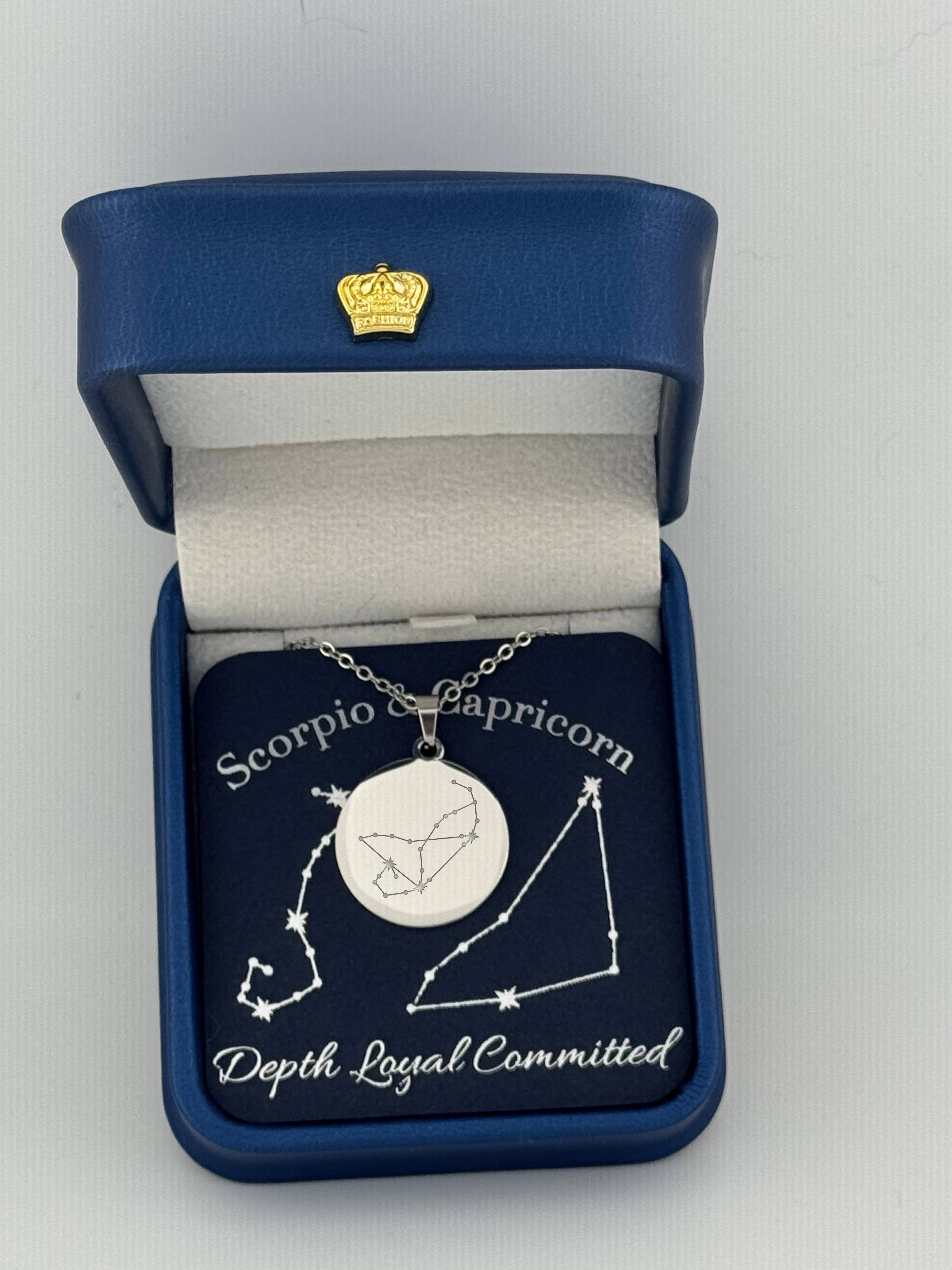 Silver Scorpio and Capricorn constellation medallion necklace in gift box with silver foil zodiac card
