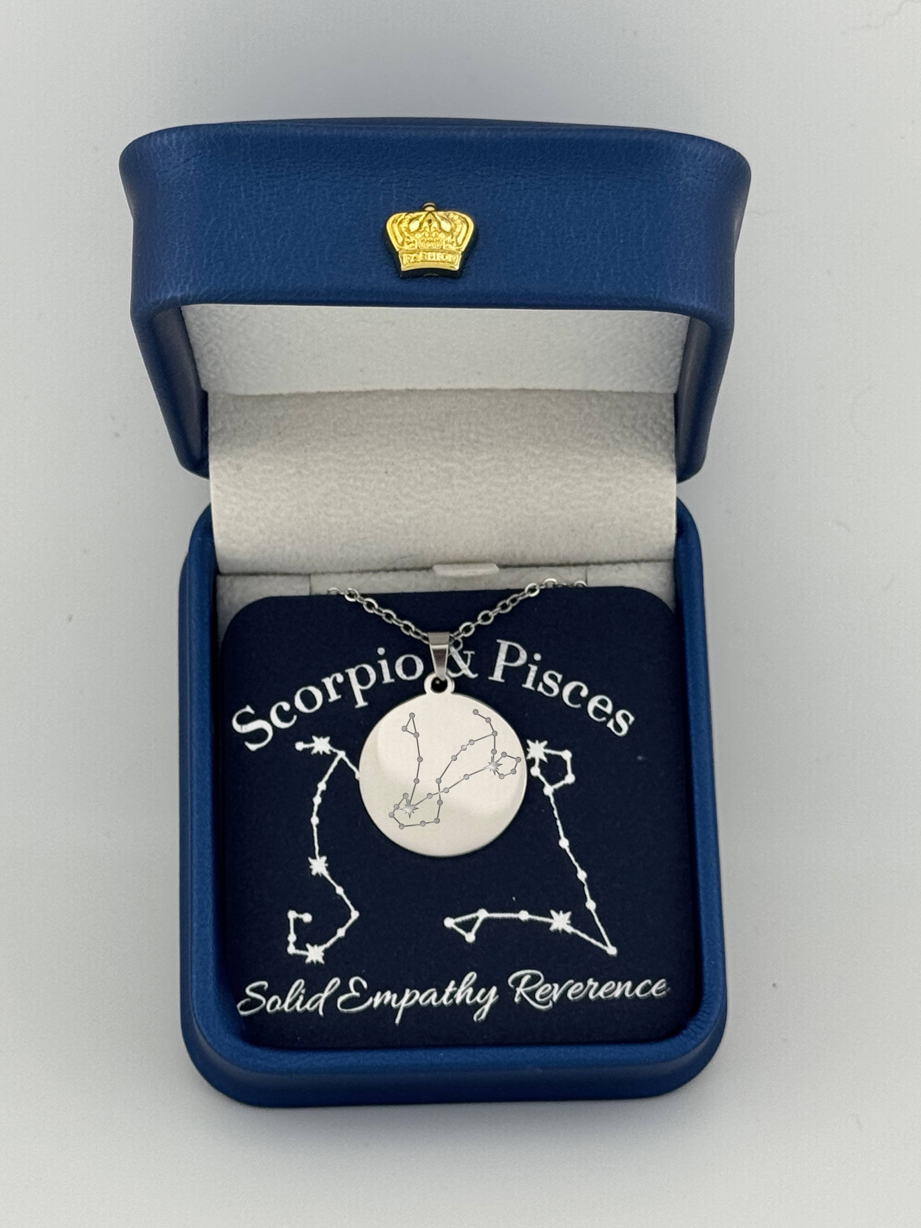 Silver Scorpio and Pisces constellation medallion necklace in gift box with silver foil zodiac card
