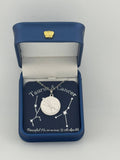 Silver Taurus + Cancer constellation medallion necklace in gift box with silver foil zodiac card
