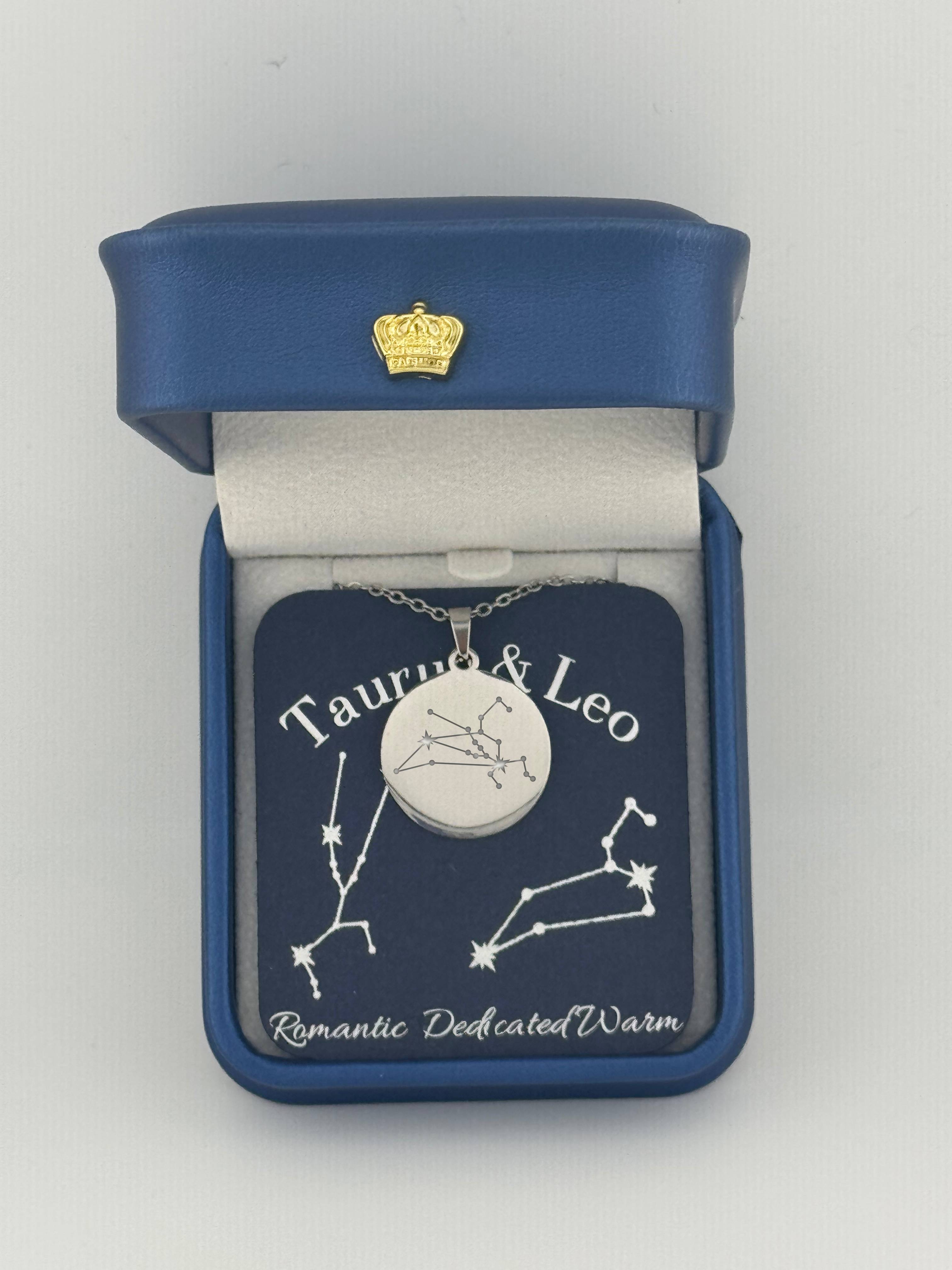 Silver Taurus + Leo constellation medallion necklace in gift box with silver foil zodiac card
