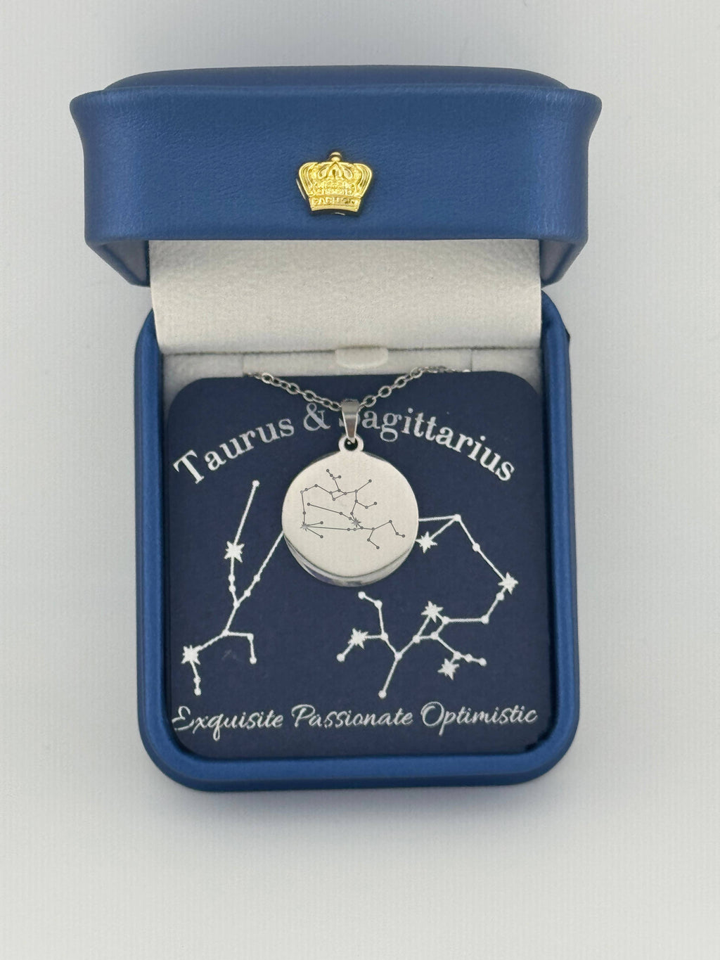 Silver Taurus-Sagittarius constellation medallion necklace in gift box with silver foil zodiac card

