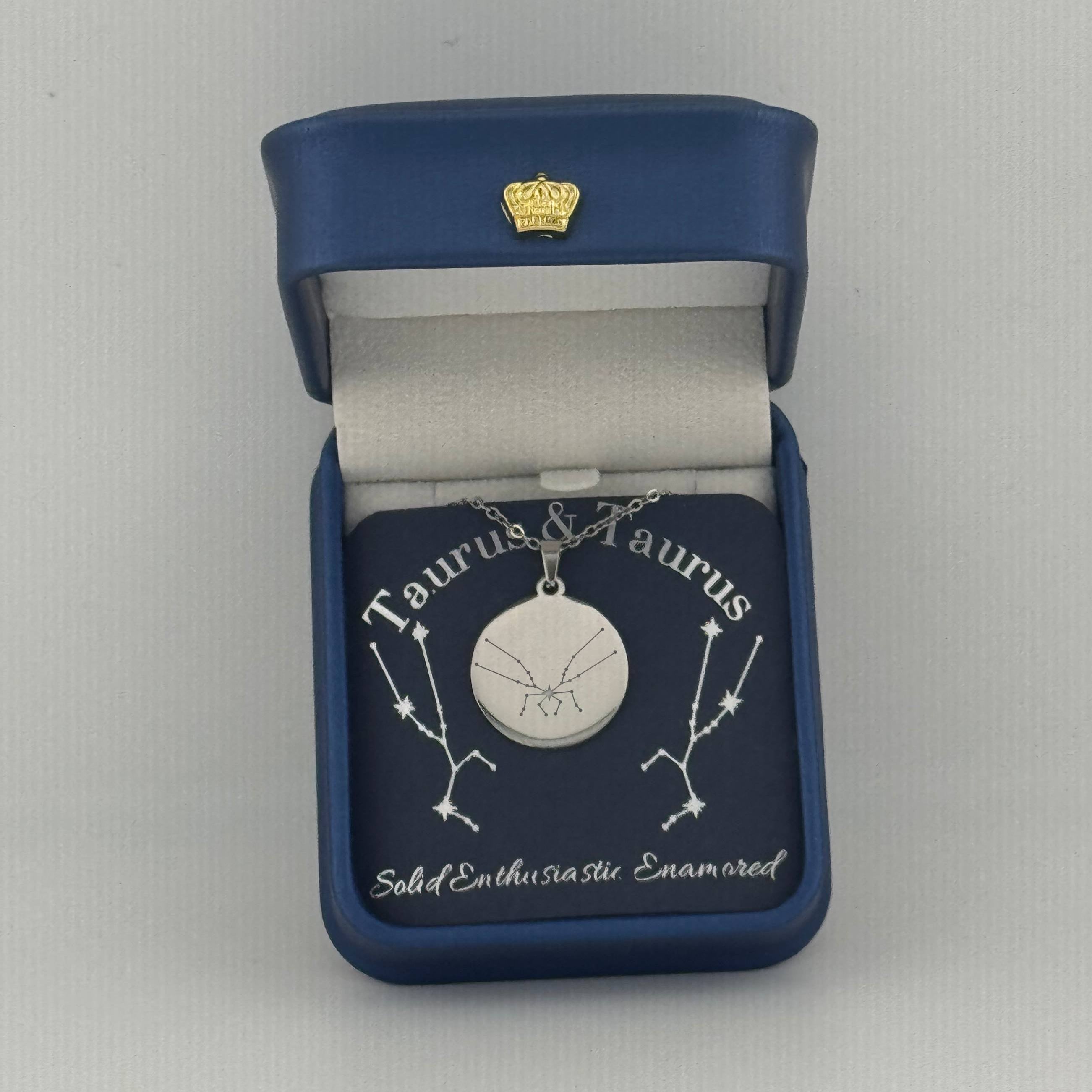 Silver Taurus + Taurus constellation medallion necklace in gift box with silver foil zodiac card
