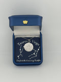 Silver Taurus + Virgo constellation medallion necklace in gift box with silver foil zodiac card
