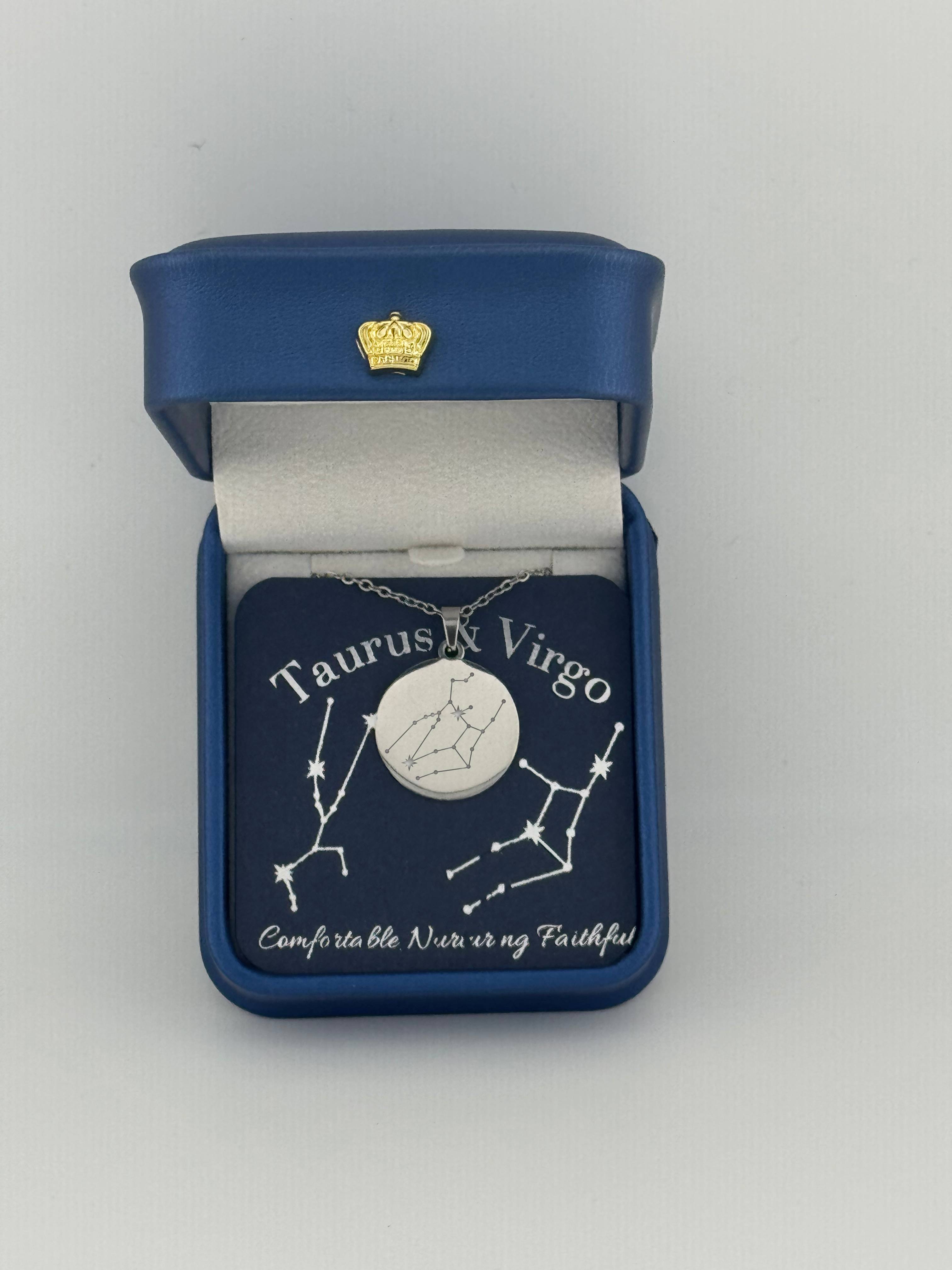Silver Taurus + Virgo constellation medallion necklace in gift box with silver foil zodiac card
