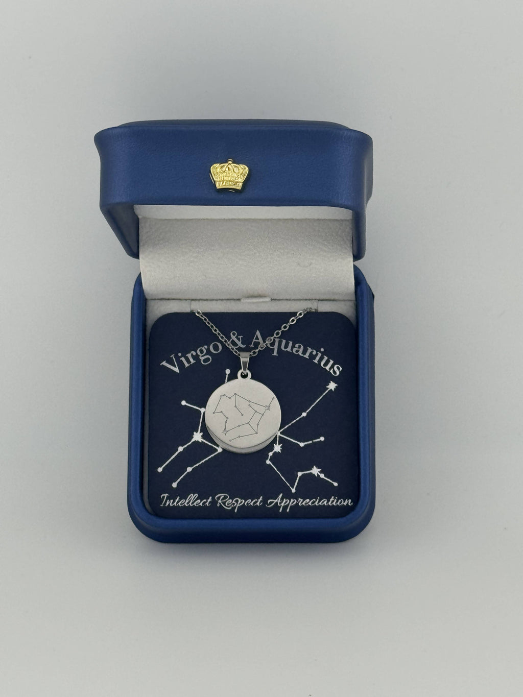 Silver Virgo and Aquarius constellation medallion necklace in gift box with silver foil zodiac card

