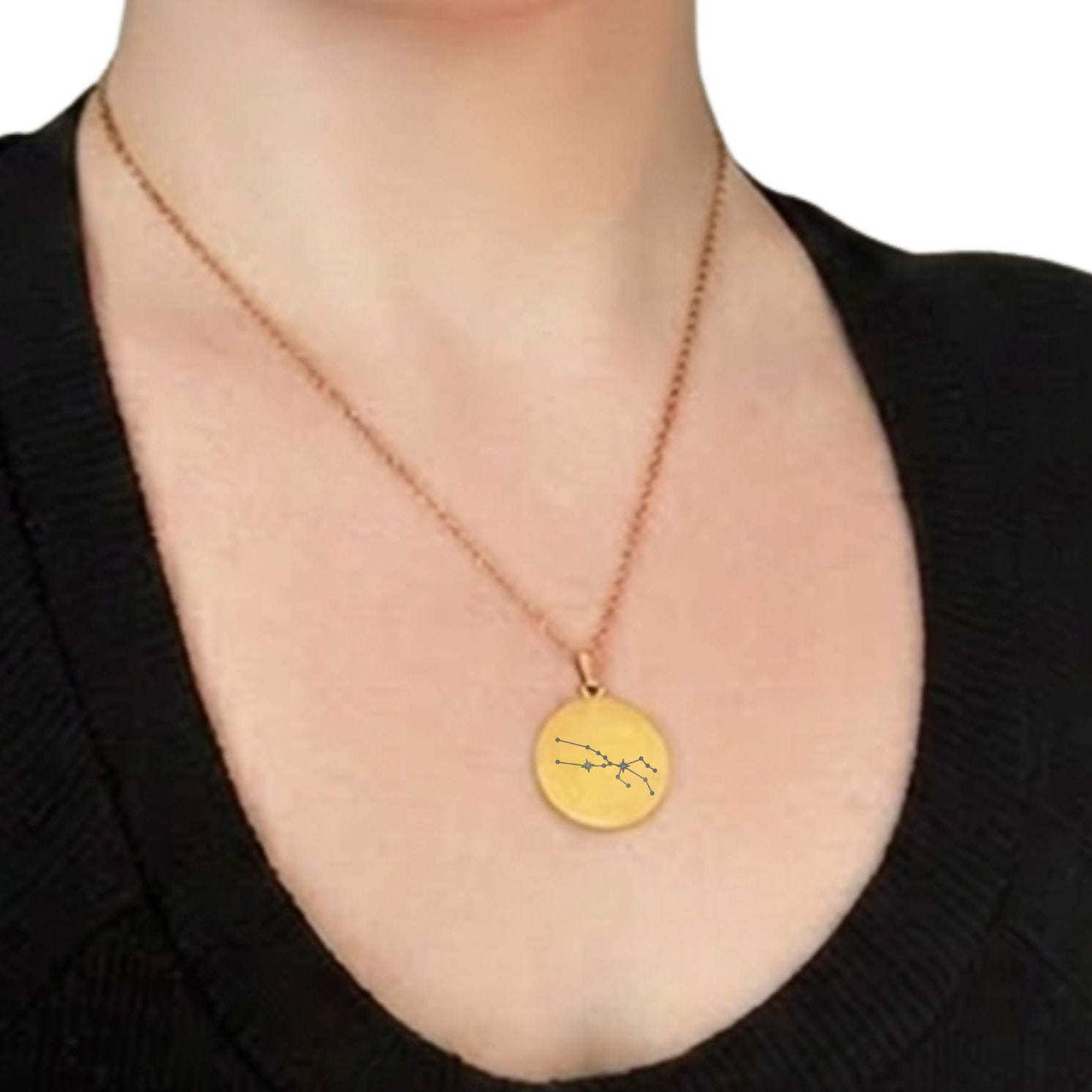 Woman wearing gold Aries + Taurus constellation medallion necklace, constellation only design
