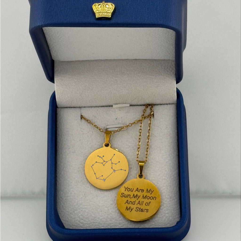 Gold Aries + Sagittarius zodiac medallion necklaces, one with constellation and one with custom engraved message 'you are my sun, my moon, and all of my stars'