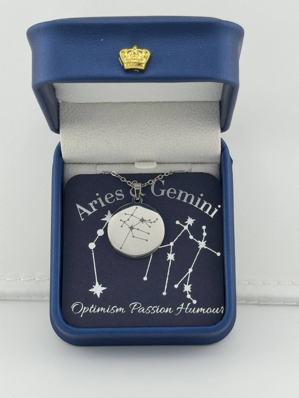 Silver Aries + Gemini constellation medallion necklace in gift box with silver foil zodiac card"

