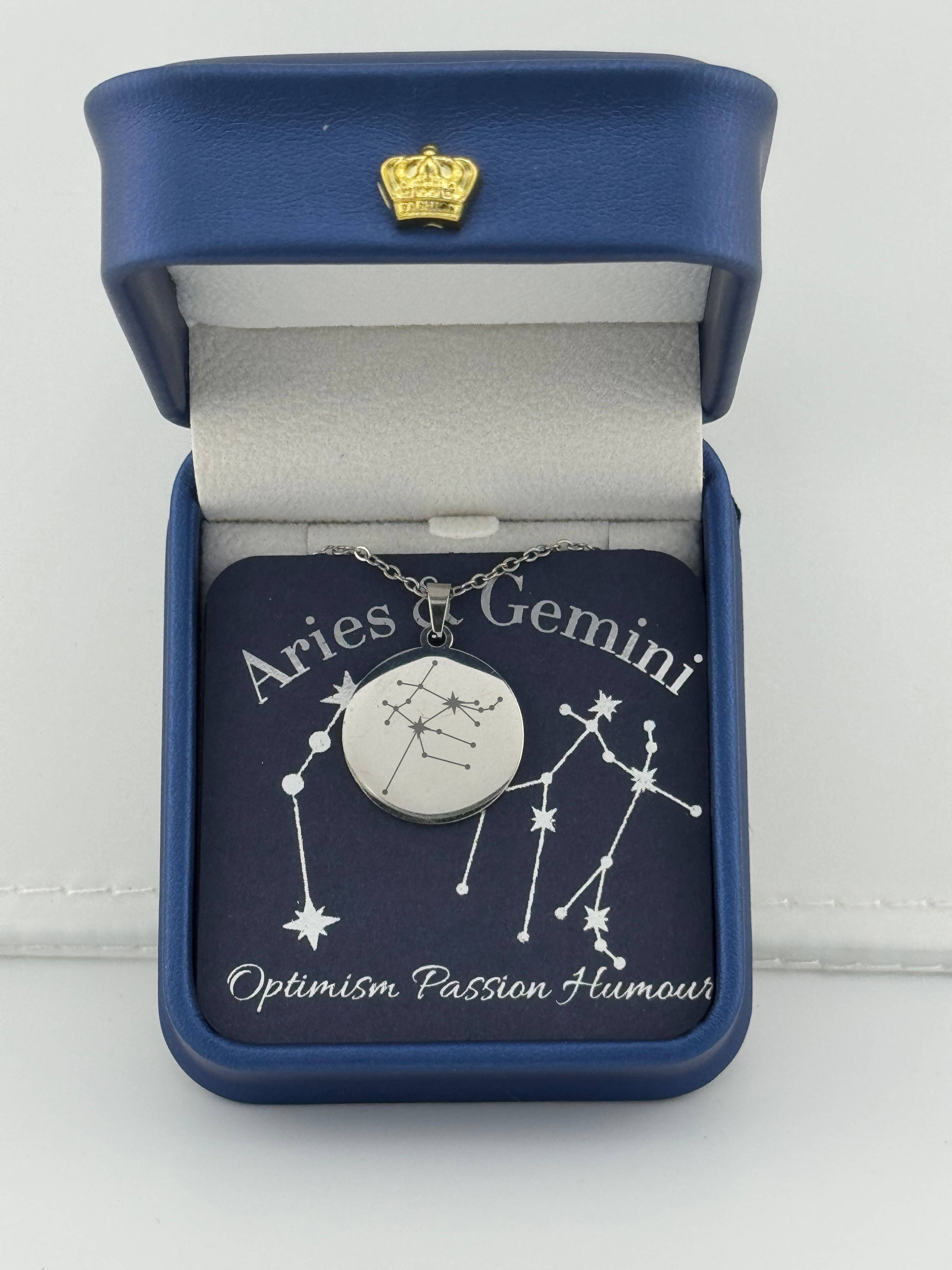 Silver Aries + Gemini constellation medallion necklace in gift box with silver foil zodiac card"
