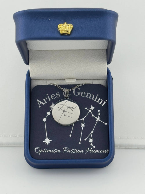 Silver Aries + Gemini constellation medallion necklace in gift box with silver foil zodiac card"
